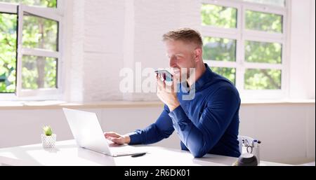 Young Man Using Voice Recognition Function On Mobile Phone Stock Photo