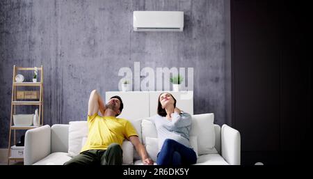 Sick Couple Having Cold And Sore Throat From Air Conditioner Stock Photo