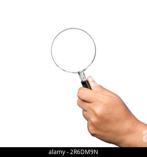 woman hand holding magnifying glass isolated on white background. optical zoom lens is macro tool, concept for education, science. Stock Photo
