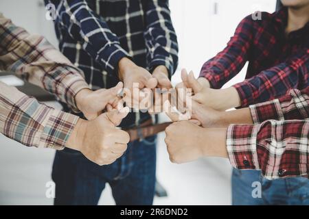 group of like-minded people cupping their palms together Stock Photo