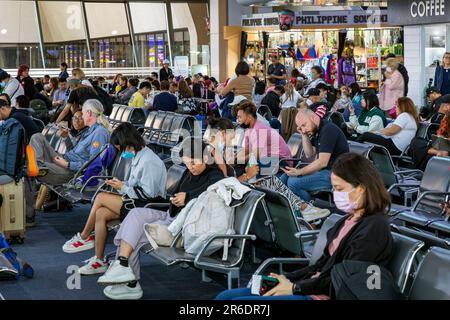 Passengers waiting at departure gate at Ninoy Aquino International Airport, Manila, Philippines Stock Photo
