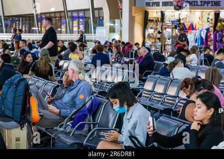 Passengers waiting at departure gate at Ninoy Aquino International Airport, Manila, Philippines Stock Photo