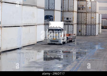 Trucks in the view of the container industry Stock Photo