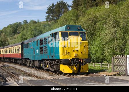 Former British Rail Class 31 diesel-electric locomotive 31128 'Charybdis' approaching Levisham station on the  North Yorkshire Moors Railway (NYMR). Stock Photo