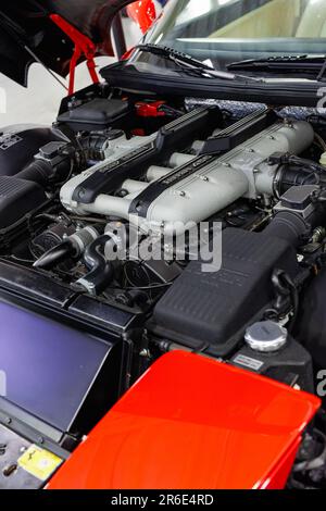 Engine of a Ferrari 456 with an Open Hood. Stock Photo