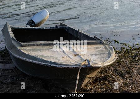 the boat stands on the bank of the river. Means of transportation on water. Stock Photo