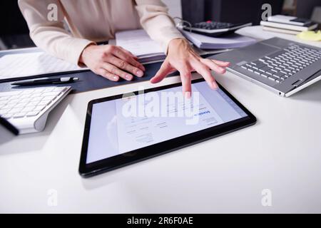 E Invoice On Tablet. Online Electronic Bill Management Stock Photo