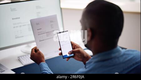 Taking Invoice Document Photo Using Phone Or Smartphone Stock Photo