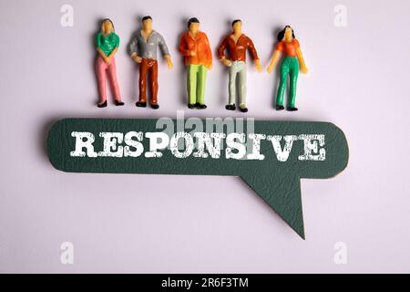 Responsive Concept. Green speech bubble with text and miniature human figures on a white background. Stock Photo