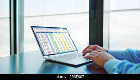 Spreadsheet Data Analyst Using Computer Software On Laptop Stock Photo