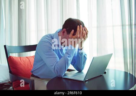 Stressed Sick Employee Man At Computer. Lazy Man Stock Photo