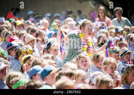 Brasschaat, Belgium. 09th June, 2023. School children cheer during the press launch of Studio 100's new grand family musical, featuring K3 and many other familiars, at the Openluchtschool Sint-Ludgardis in Brasschaat, Friday 09 June 2023. BELGA PHOTO JASPER JACOBS Credit: Belga News Agency/Alamy Live News Stock Photo