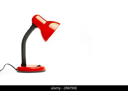 A black and red desk lamp on a white background with copy space Stock Photo