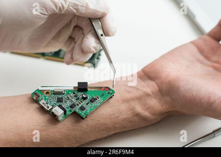 Hand with implantation of micro chip. X-Ray view close-up. Chipization of people, control population Stock Photo