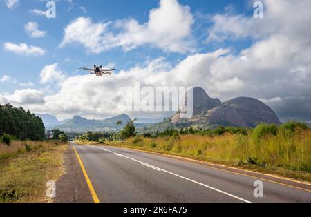 DJI Mini Pro 3 drone (UAV) flying near Elephant Rock, Malawi Stock Photo