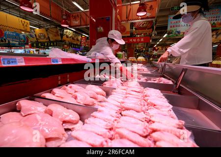 Zaozhuang, China's Shandong Province. 9th June, 2023. A customer shops at a supermarket in Zaozhuang, east China's Shandong Province, June 9, 2023. China's consumer price index (CPI), a main gauge of inflation, edged up 0.2 percent year on year in May, the National Bureau of Statistics (NBS) said Friday. The figure was higher than the 0.1-percent increase in April. Credit: Sun Zhongzhe/Xinhua/Alamy Live News Stock Photo