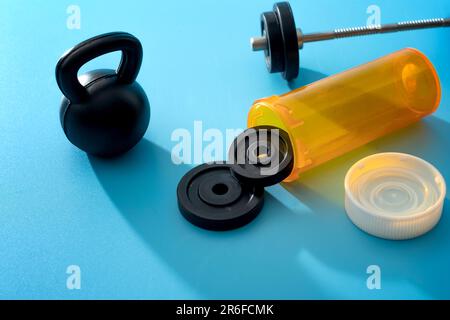 Strength Training Equipment and Prescription Pill Bottle Concept for Sort and Exercise Medicine, Therapeutic Exercise Benefits, Fitness as Medicine an Stock Photo