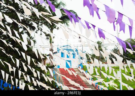 Taperoa, Bahia, Brazil - June 22, 2022: Colorful decoration with flags for the feast of Sao Joao in the city of Taperoa, Bahia. Stock Photo