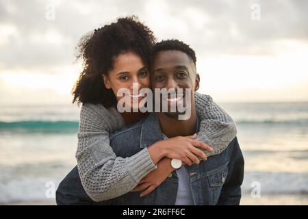 Smiling young multiethnic couple having fun at the beach Stock Photo