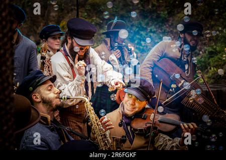 Old Time Sailors performing at Trebah Garden Amphitheatre in Cornwall in the UK. Stock Photo