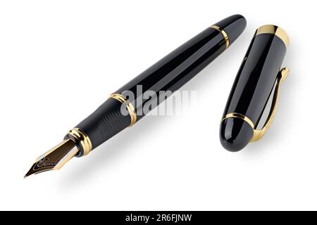 Retro style fountain pen, black with golden trim, isolated on white background Stock Photo