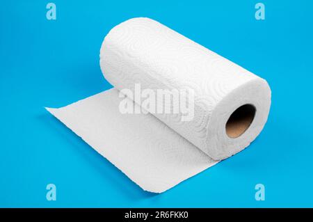 White roll paper towels on blue background. Paper towel Stock Photo