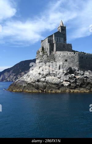 Italy - Porto Venere - May 8,  2022: The Romanesque church of San Pietro is a Catholic religious building in Porto Venere under the Doria Castle. Stock Photo