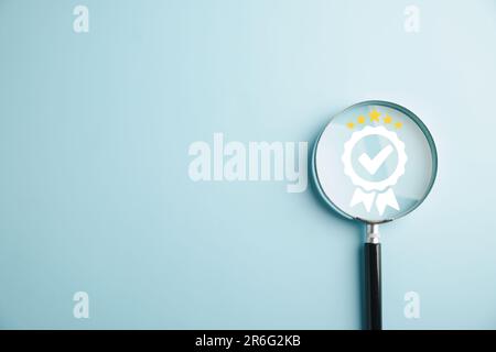 Certification and ISO quality concept illustrated with a magnifying glass highlighting Stock Photo