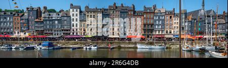 panoramic view of the facades of houses along the harbour of Honfleur in the Normandy, France Stock Photo