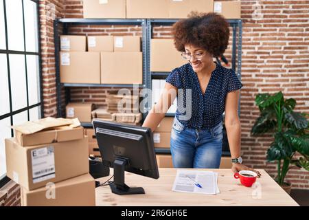 African american woman ecommerce business worker using coputer at office Stock Photo
