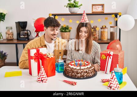 Mand and woman couple having birthday celebration at home Stock Photo