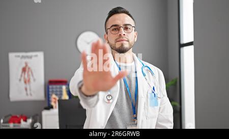 Stop sign and doctor hand doing prohibition sign. Doctor warning about ...