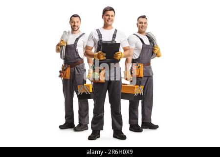 Team of electricians holding cables and team leader holding a clipboard isolated on white background Stock Photo