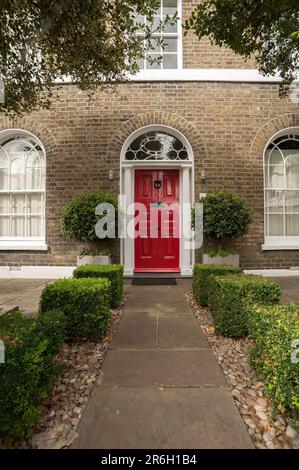 LONDON, UK - AUGUST 15, 2009:  Front facade of Georgian  House with red front door Stock Photo