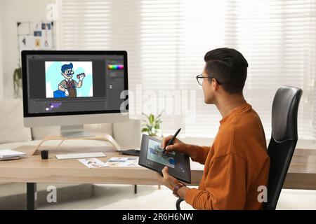 Animator using graphic tablet and computer. Illustration on screens Stock Photo