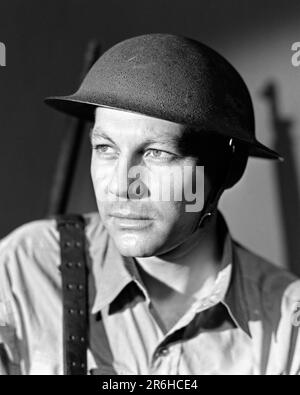 1940s UNITED STATES SOLDIER GRIM FACE WEARING A BRODIE HELMET AND CARRYING SPRINGFIELD RIFLE - m1287 HAR001 HARS MYSTERY LIFESTYLE HISTORY CONFLICT WW2 STUDIO SHOT MOODY UNITED STATES COPY SPACE PERSONS RIFLE THOUGHTFUL INSPIRATION MALES RISK EXPRESSIONS TROUBLED B&W CONCERNED SADNESS FREEDOM DREAMS HEAD AND SHOULDERS ADVENTURE PROTECTION STRENGTH COURAGE AND EXCITEMENT LEADERSHIP WORLD WARS PRIDE WORLD WAR WORLD WAR TWO WORLD WAR II MOOD UNIFORMS CONCEPTUAL GLUM SPRINGFIELD SUPPORT WORLD WAR 2 SINCERE DETERMINED GRIM SOLEMN FOCUSED INTENSE MID-ADULT MID-ADULT MAN MISERABLE BLACK AND WHITE Stock Photo