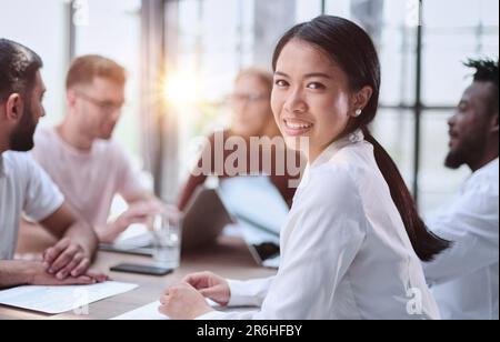 Silhouettes of people sitting at the table. Stock Photo