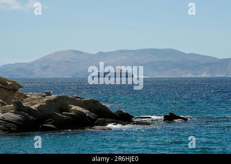 Ios, Greece - May 16, 2021 : View of a Ferry boat leaving the port of Ios and heading for Santorini Greece Stock Photo