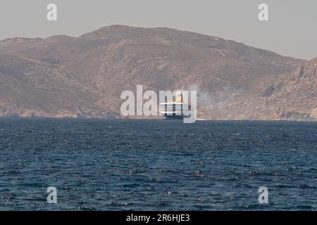 Ios, Greece - May 16, 2021 : View of a Ferry boat approaching  the port of Ios Greece Stock Photo