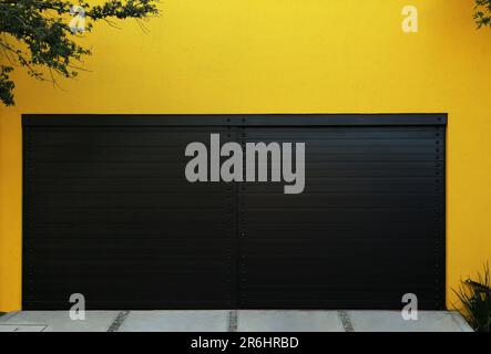 Closed gates of modern garage. Exterior design Stock Photo