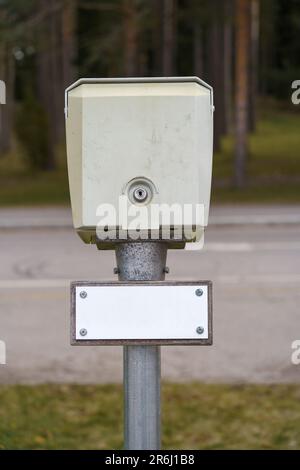 Outdoor power socket for car heating close up with empty white sign. Stock Photo