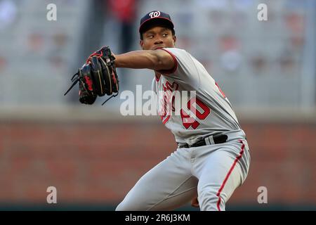 ATLANTA, GA – APRIL 11: Atlanta left fielder Eddie Rosario (8) singles  during the MLB game between the Cincinnati Reds and the Atlanta Braves on  April 11th, 2023 at Truist Park in