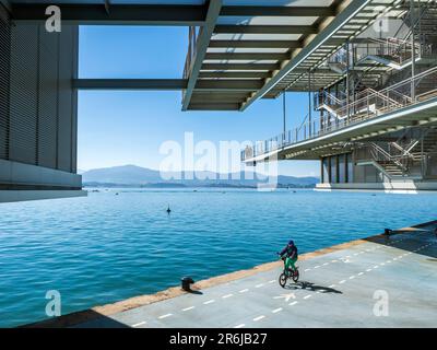 People walking along the steel walkways of the Centro Botin Museum in the port of Santander. Stock Photo