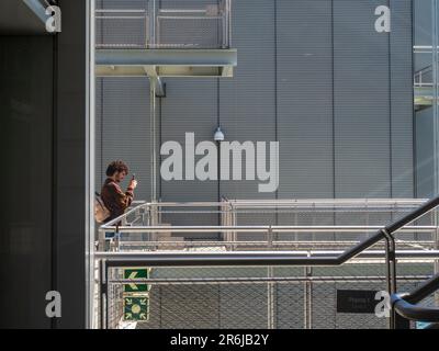 People walking along the steel walkways of the Centro Botin Museum in the port of Santander. Stock Photo