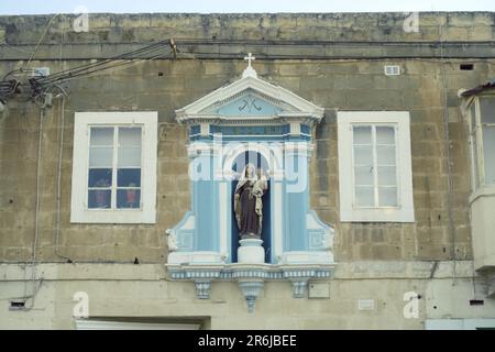 votive aedicule of Madonna and Child in a street of Paola, Malta Stock Photo