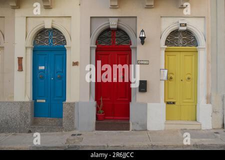 three colourful front door in Paola, Malta Stock Photo