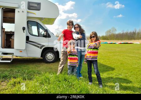 Family vacation, RV travel with kids, happy parents with children have fun on holiday trip in motorhome, camper van exterior Stock Photo