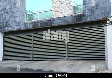 Closed roller shutter gates of modern garage Stock Photo