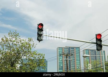 Overhead traffic lights in city. Road rules Stock Photo