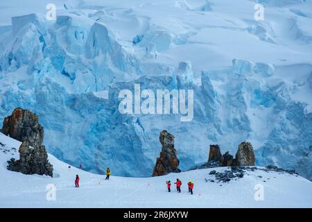 Hikers climbing Half Moon Island, South Shetland Islands, Antarctica, Polar Regions Stock Photo